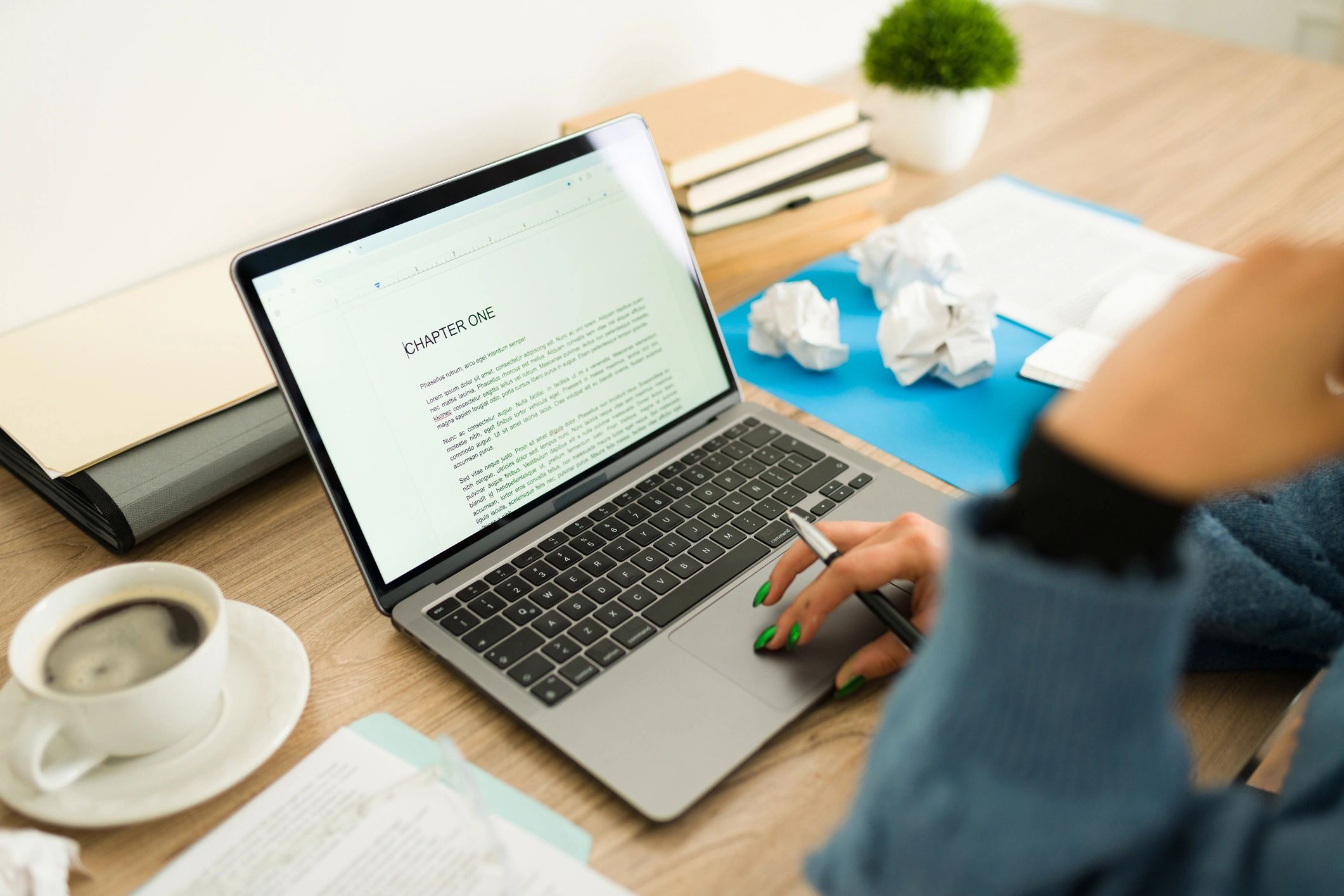 A creative workspace with writing materials and coffee, symbolizing collaboration and inspiration.